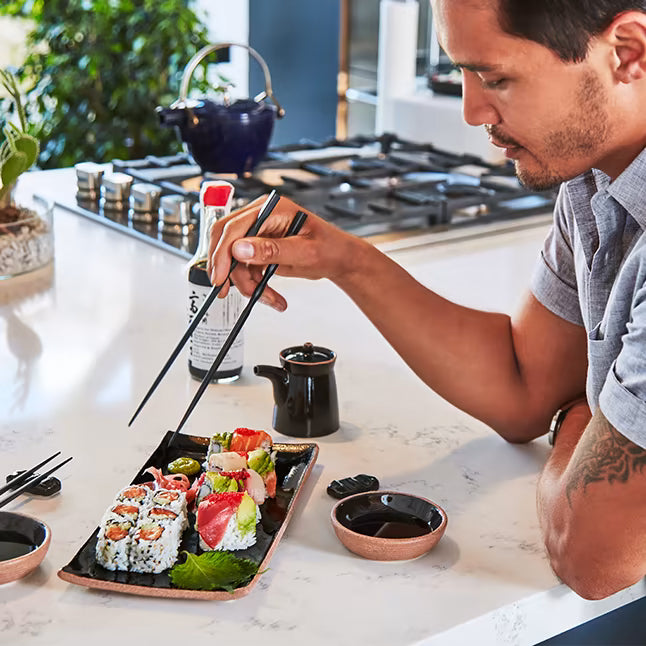 Set Sushi. Bamboo mat, chopsticks, wasabi, soy sauce, nigiri, rolls and  wood serving board. By MoreVector
